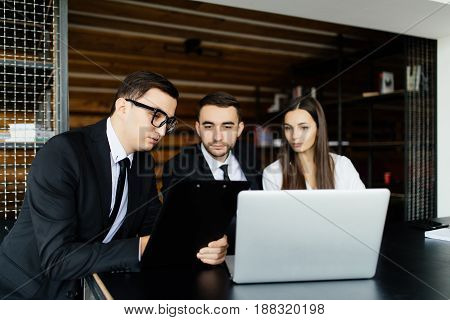 Sell Concept. Business Man Explain Documents Details For Team In Office.