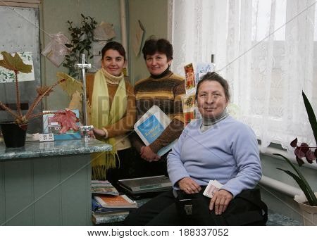 KAMIN UKRAINE - 08 December 2008: Unknown postwoman on work place in post office
