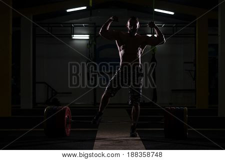 Silhouette Bodybuilder Flexing Muscles