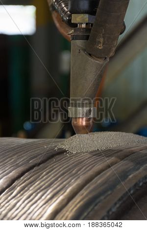Overlay welding hard surfacing of steel roll by submerge arc welding process