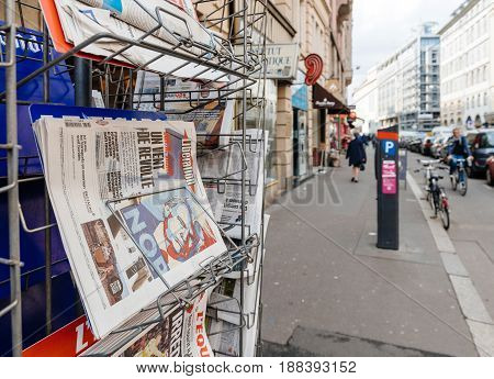 PARIS FRANCE - MAR 23 2017: Donald Trump Nope poster on cover of Liberation newspaper next to other international magazines covers at press kiosk newsstand featuring headlines