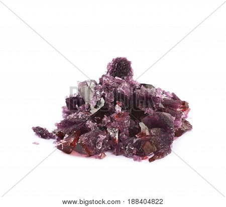 Grown crystal of maroon colored salt isolated over the white background