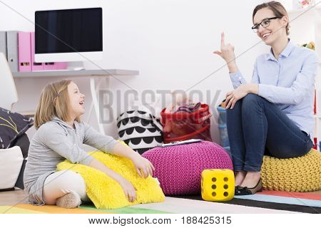Psychotherapist Teaching Girl To Count