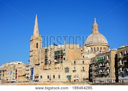 VALLETTA, MALTA - MARCH 30, 2017 - View of St Pauls Anglican Cathedral and the Basilica of Our Lady of Mount Carmel Valletta Malta Europe, March 30, 2017.