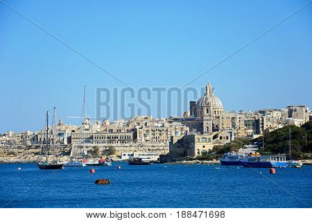 VALLETTA, MALTA - MARCH 30, 2017 - View of St Pauls Anglican Cathedral and the Basilica of Our Lady of Mount Carmel seen from the Grand Harbour Valletta Malta Europe, March 30, 2017.
