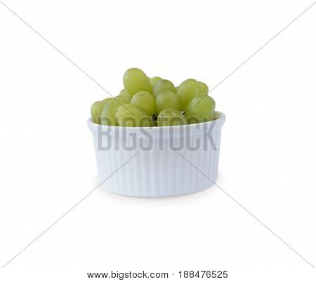 Grapes in a ceramic bowl isolated on white background. Green grapes Kish Mish