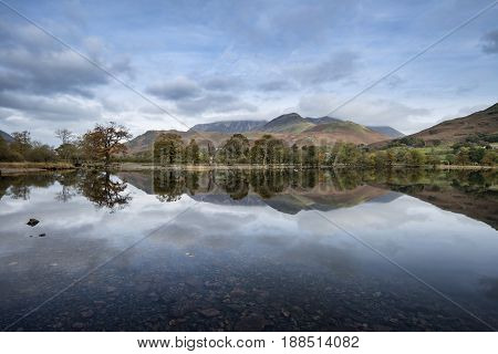 Stuning Autumn Fall Landscape Image Of Lake Buttermere In Lake District England