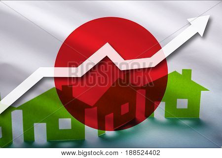 The flag of Japon and the rising prices of real estate. Rental prices are rising up in the tourist season. Home and white arrow up on a flag background.