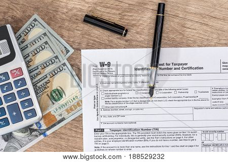 Tax Form - W9 - With Dollar And Pen.