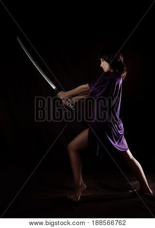 beautiful sexy woman with samurai sword. sexy woman with katana.