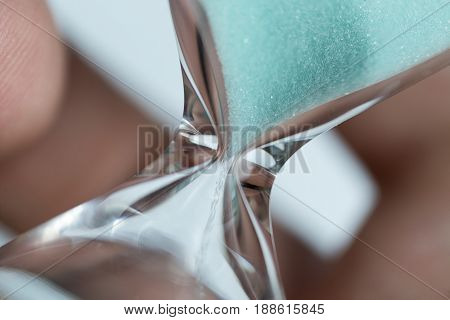 Hand Holds Hourglass Close-up.