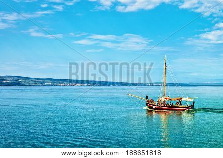 Boat With People In Adriatic Sea In Omis