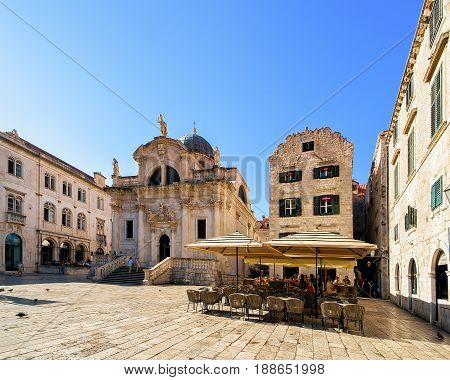 St Blaise Church On Stradun Street And People In Dubrovnik