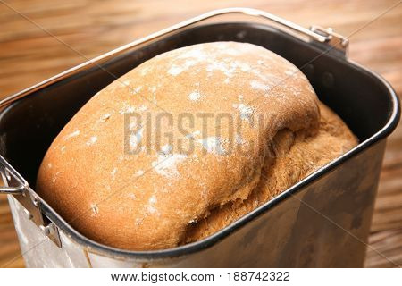 Baking pan with fresh homemade bread, closeup