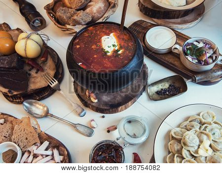 Russian borsch at pot on the table