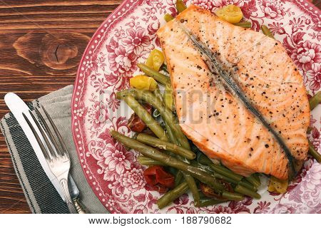 Salmon steak, veggies and herbs. Healthy eating concept