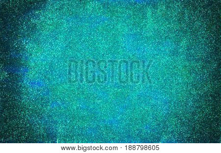 Background made of mermaid blue glitter nail polish and blue craft foam