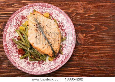 Salmon steak, veggies and herbs. Healthy eating concept
