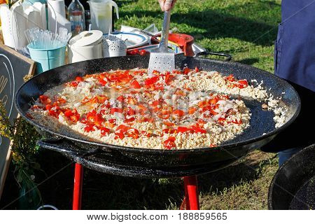 Cooking traditional paella outdoors on a holiday