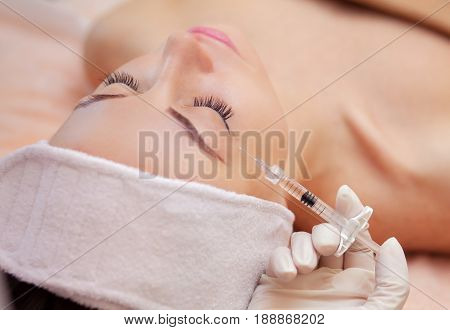 The Doctor Cosmetologist Makes The Botulinotoxin Injection Procedure For Tightening And Smoothing Wr