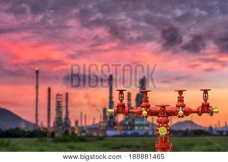 Fire hydrants and oil refinery plant blur background.