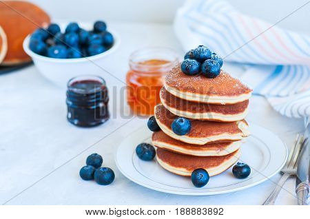 Close Up Of Stack Of Homemade Pancakes With Bluberries In A White Plate. Healthy Breakfast Concept.