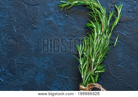 Close Up Of Bunch Of Green Fresh Rosemary On A Gray Background. Copy Space And Top View.