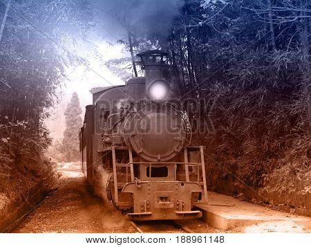 Steam narrow-gauge train moves from Yuejin to Bagou through the jungle. Jiayang Mining Region. Sichuan province. China.