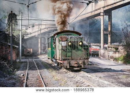Steam narrow-gauge train departs from Yuejin to Bagou. Jiayang Mining Region. Sichuan province. China.