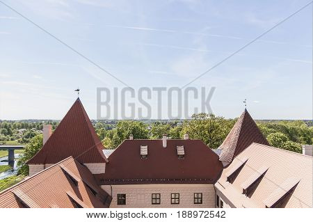 Latvija.Bauskas castle in the distance behind the trees