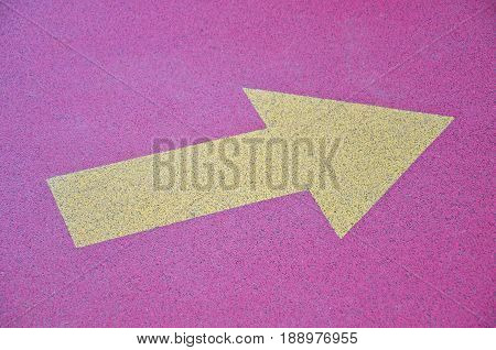 Directional arrows painted on a asphalt floor