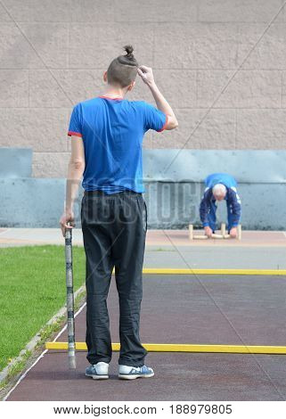 21.05.2017.Russia.Saint-Petersburg.Gorodki - a Russian folk sports game. In this game you need specific distances to smash figures made in different ways from five wooden cylinders.