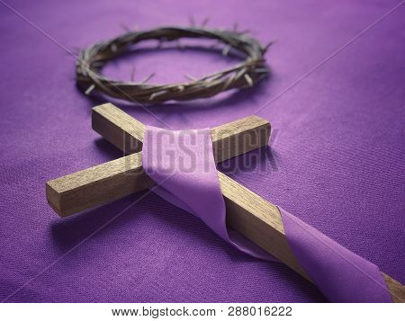 Good Friday, Lent Season And Holy Week Concept - A Religious Cross And A Woven Crown Of Thorns On Pu