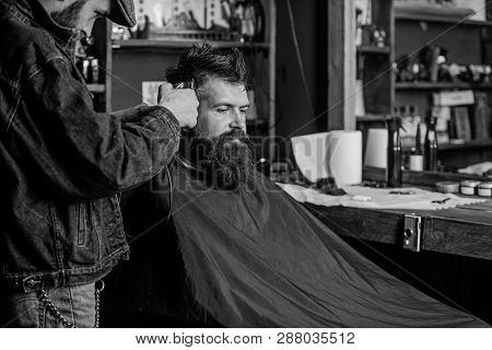 Hipster Lifestyle Concept. Hipster Client Getting Haircut. Barber With Hair Clipper Work On Hairstyl