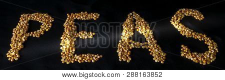 Text Peas. The Word Pea. Dried Peas. Peas On A Black Background. Golden Peas On A Dark Background. T