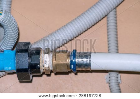 Connection Of Plastic Pipes Through The Coupling. Plumbing Water Supply