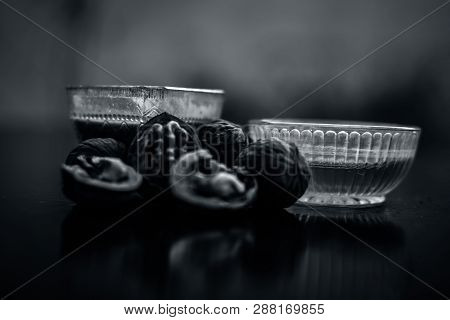 Close Up Of Best Home Remedy To Treat Anemia In A Glass Bowl On Wooden Surface Consisting Of Walnut