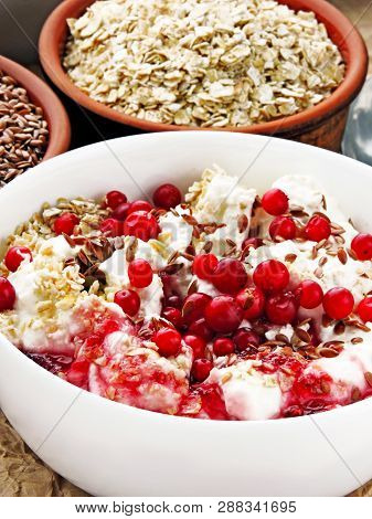Delicious And Healthy Breakfast With Oat Flakes, Yoghurt, Flaxseed And Cowberry. Energy Breakfast Co