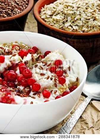 Delicious And Healthy Breakfast With Oat Flakes, Yoghurt, Flaxseed And Cowberry. Energy Breakfast Co