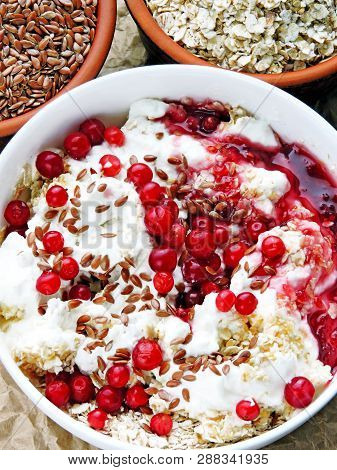 Delicious And Healthy Breakfast With Oat Flakes, Yoghurt, Flaxseed And Cowberry. Energy Breakfast Co
