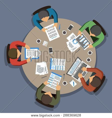 Group Of Business People Working At Round Office Table, Top View