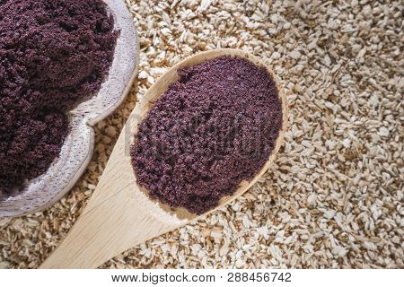 Acai Powder In Bowl On Wooden Background