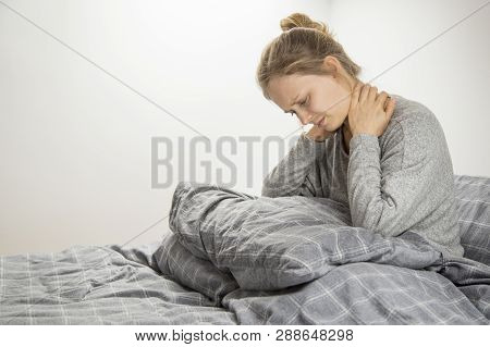 Frustrated Girl Feeling Neck Ache After Waking Up. Young Woman Suffering From Osteochondrosis. Healt