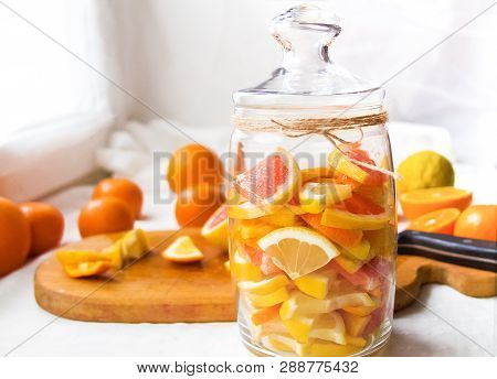 Lemons, Oranges, Tangerines, Grapefruit, Cut Into Slices And Folded Into A Jar