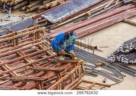 Industrial Welding Worker For Steel Work Construction In Area Building With Welding Process By Shiel
