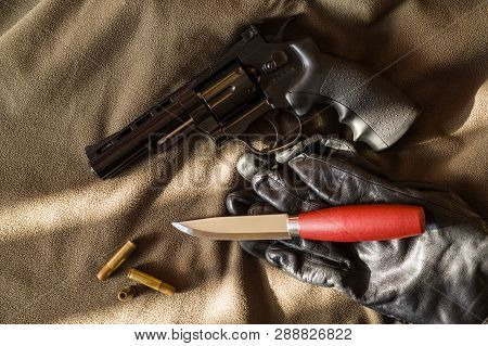 Firearms And Edged Weapons. Knife And Gun.