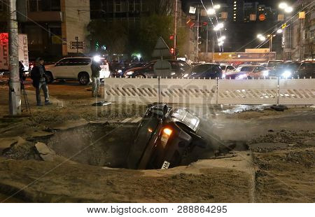Car Partially Collapsed Under The Ground