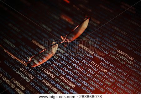 Computer Hacker. Red Dangerous Code Breach Into Red Binary Code With Glasses Place Over Led Panel. V