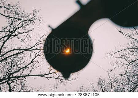 Real Solar Eclipse On March 20, 2015. Moon Covering Sun In Partial Eclipse. Hand Holding A Special S