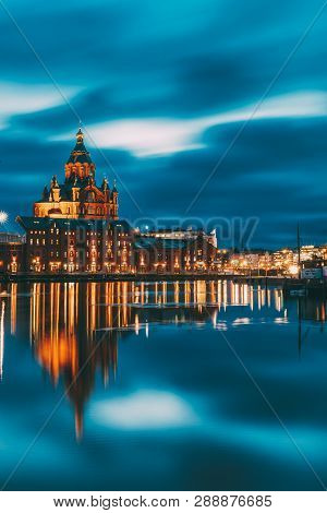 Helsinki, Finland. View Of Kanavaranta Street With Uspenski Cathedral In Evening Night Illuminations
